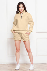 Caramel quarter-zip loungewear set with shorts and a mock neck sweatshirt.