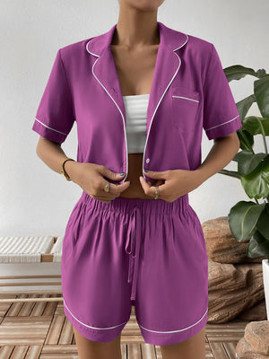 Red-Violet pajama set with contrast trim, featuring a cropped button-up shirt and drawstring shorts.