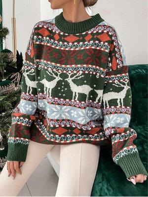 Fair Isle reindeer motif knit sweater in green with holiday patterns and a mock neck.