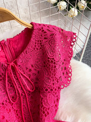 Fuchsia pink lace A-line dress with cutout detail and tie neckline.