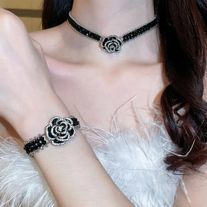 Black crystal rose choker necklace with matching bracelet, featuring sparkling details.