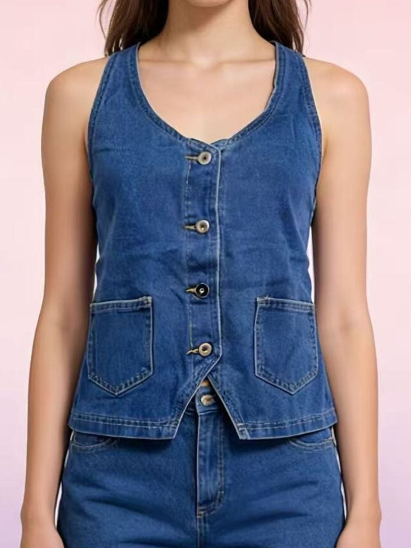 Button-down denim halter vest in dark blue with two front pockets and a V-neckline.