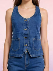 Button-down denim halter vest in dark blue with two front pockets and a V-neckline.