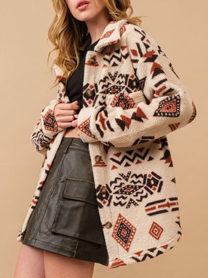 Beige sherpa overshirt jacket with bold Aztec pattern, button front, and collar.