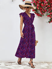 Blue Purple floral wrap midi dress with flutter sleeves and belted waist.