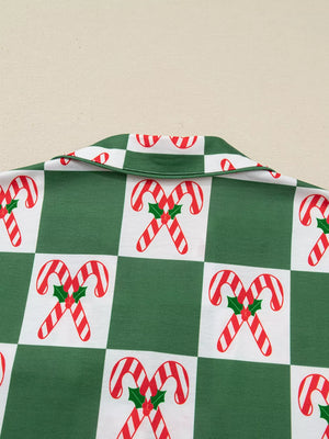 Green pajama set with candy cane checkered print and collar detail.