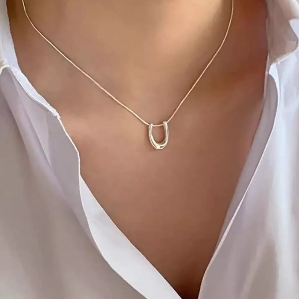 Sterling silver U-shaped pendant necklace on a delicate chain