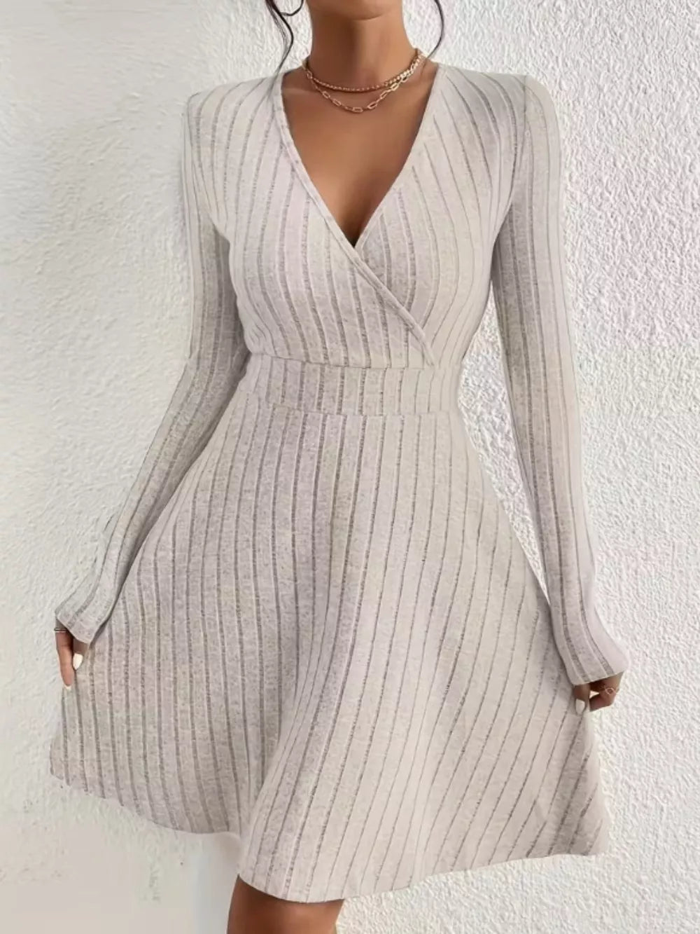 Light Gray ribbed wrap mini dress with a V-neck and long sleeves.