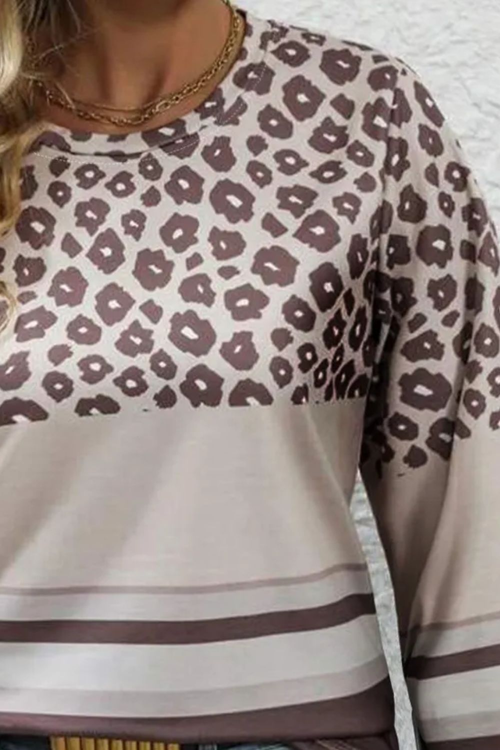 Leopard blocked stripe crewneck top with crew neckline and long sleeves.