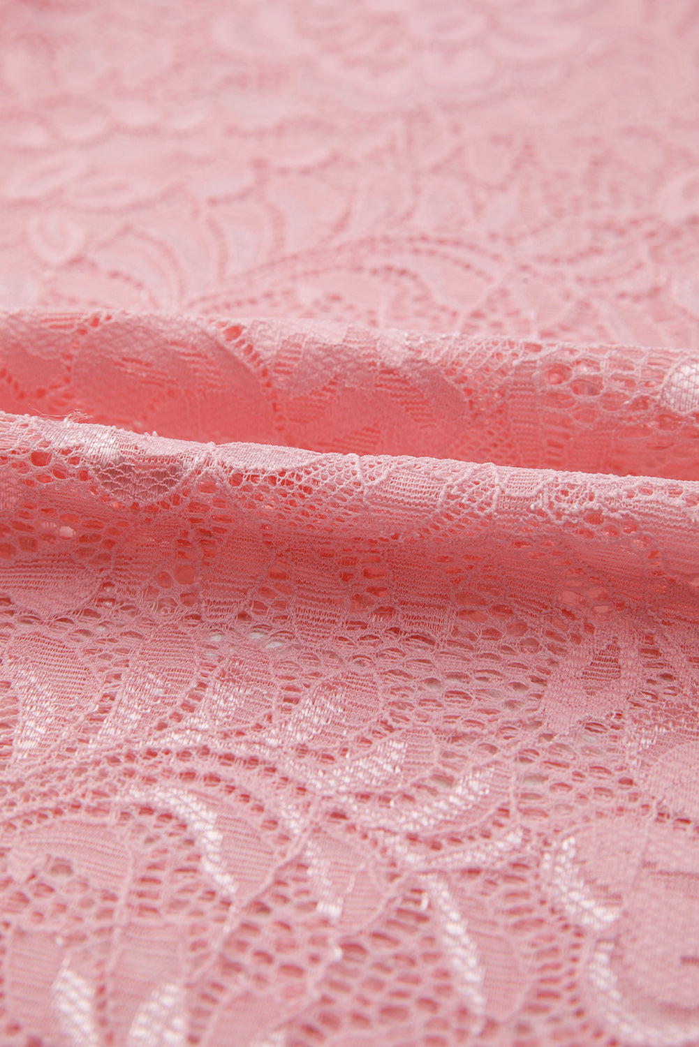 Dusty pink lace blouse with intricate floral pattern detail