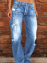 Relaxed fit light blue denim maternity jeans with distressed details and raw hem