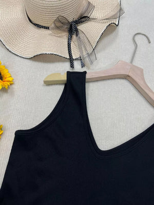 Black ribbed V-neck tank top with a close-up view of the neckline and shoulder strap.