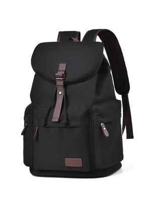 Black canvas backpack with brown leather accents and buckle closure.