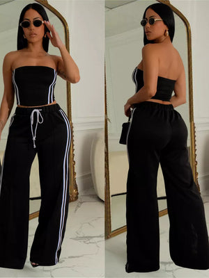 Black tube top outfit set with white side stripes on wide-leg pants and drawstring waist.