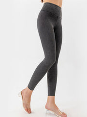Sculpted denim leggings in charcoal with a V-waist design.