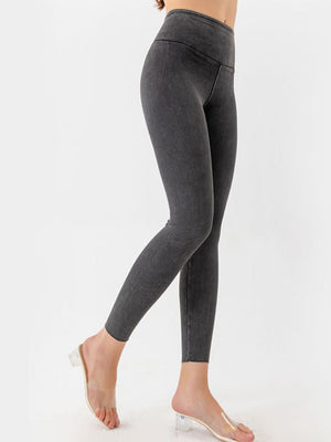Sculpted denim leggings in charcoal with a V-waist design.