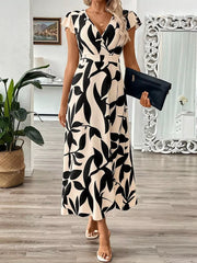 Floral print midi dress with cap sleeves and a V-neck in black and apricot abstract pattern.
