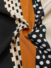 Black blouse with asymmetric stripe and polka dot pattern
