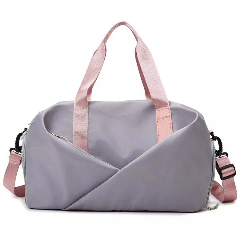 Light gray nylon travel bag with pink straps and adjustable shoulder strap.