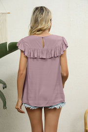 Blush pink blouse with ruffle neckline and short flutter sleeves, keyhole back.