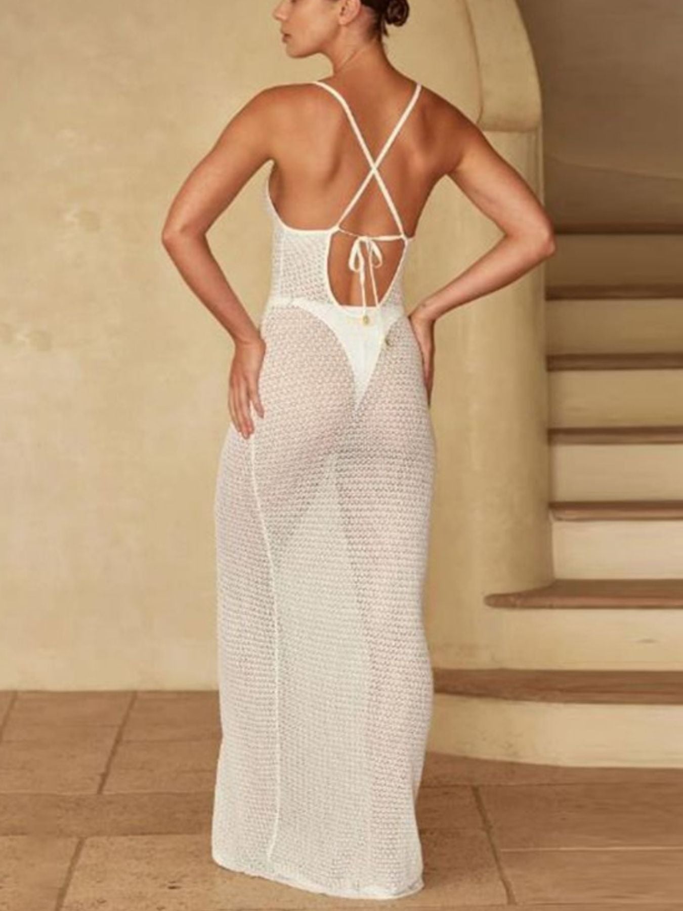 White crochet knit maxi cover-up dress with a tie-back and thong bottom.