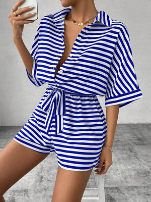 Royal blue and white striped shirt romper with button front and self-tie belt.