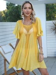 Yellow crochet inset A-line beach cover-up dress with flutter sleeves and scoop neck.