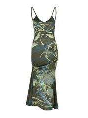 Botanical print spaghetti strap maxi dress in brown with blue floral accents, ruched bodice, and mermaid hem.