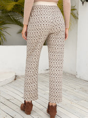 Geometric print drawstring cuff trousers in beige with a brown pattern, cropped length.