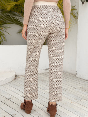Geometric print drawstring cuff trousers in beige with a brown pattern, cropped length.