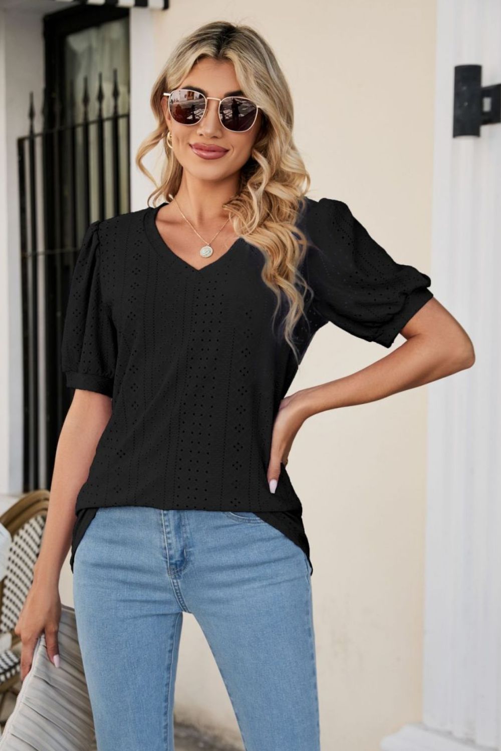 Black perforated puff sleeve v-neck blouse with eyelet detail
