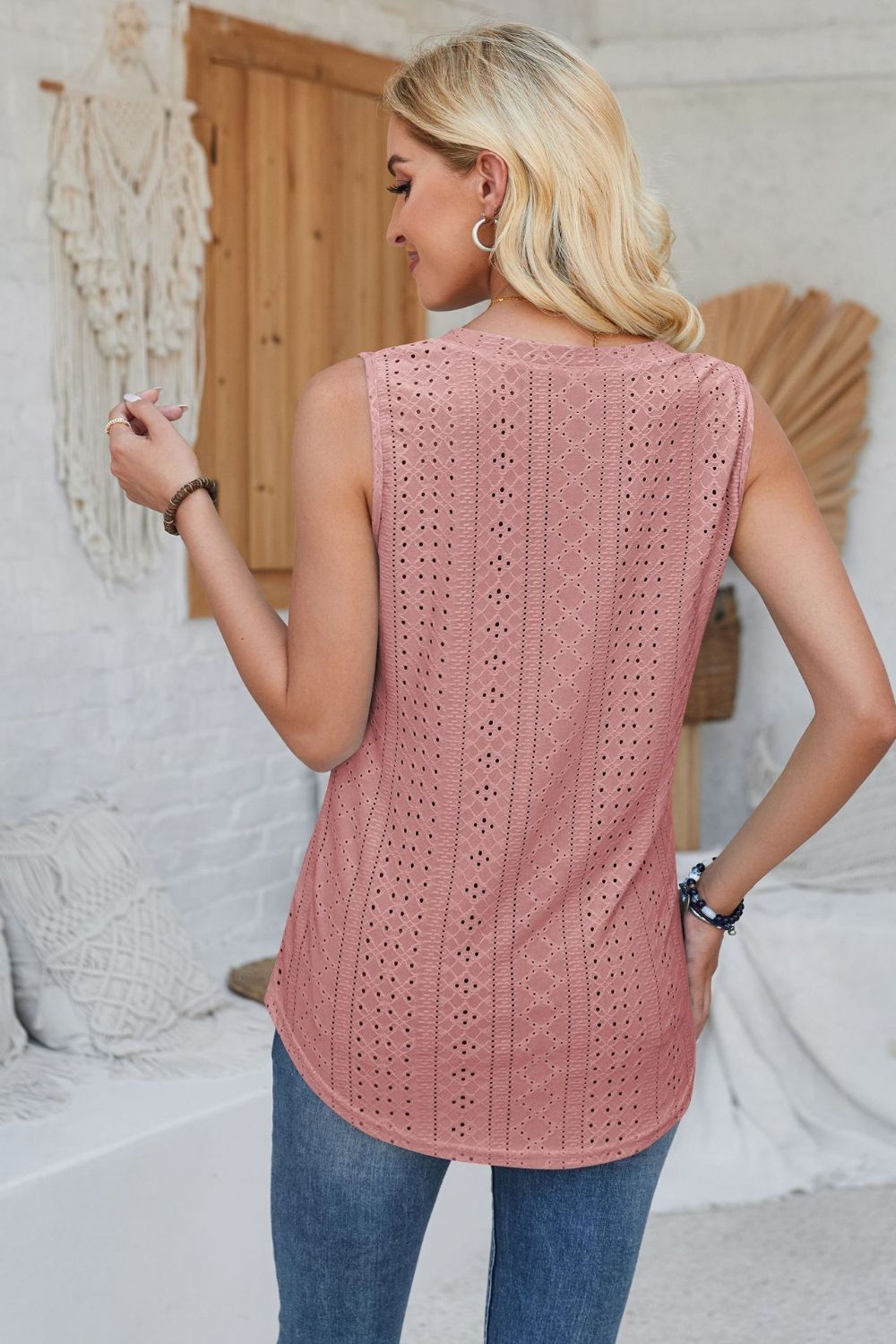 Dusty Pink perforated button-down sleeveless top with intricate eyelet pattern.