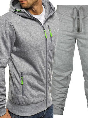 Gray zip-up tracksuit hoodie with neon green zipper accents and matching sweatpants.
