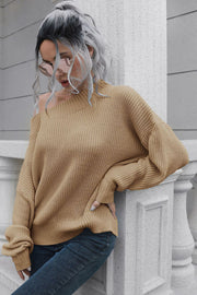 Camel ribbed sweater with off-shoulder neckline and balloon sleeves.