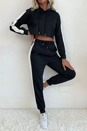 Black cropped tracksuit with white contrast trim on sleeves and pants