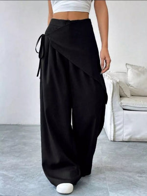 Black high-waisted wide-leg maternity pants with wrap detail and tie closure.