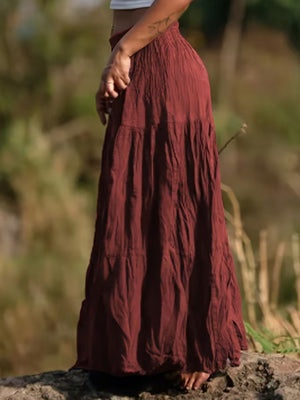 Burgundy tiered maxi skirt with elastic waist and crinkled texture.