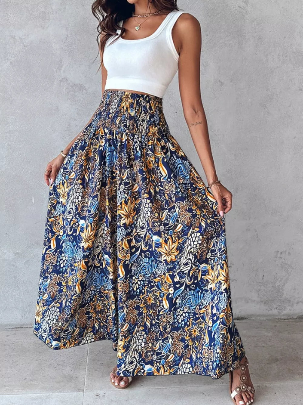 Bohemian print smocked waist maxi pants in dark navy with a floral pattern.