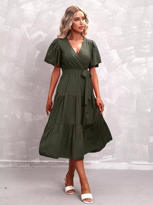 Dark green tiered midi dress with flutter sleeves and a belted waist