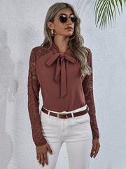 Light Mauve lace inset bow blouse with long sleeves.