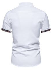 White short sleeve shirt with paisley trim on sleeves, cotton blend, curved hem
