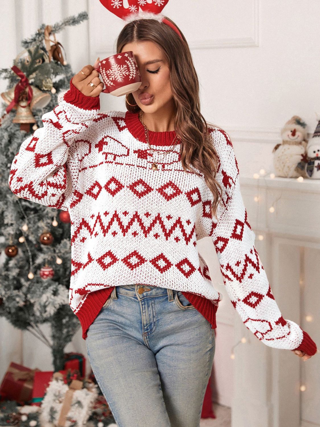 White crewneck sweater with red fair isle pattern and ribbed cuffs and hem.