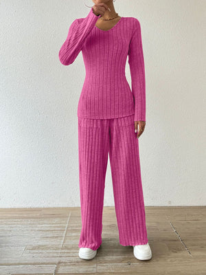 Hot Pink ribbed knit lounge set with long sleeves and flared pants.