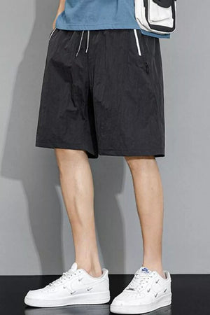 Black quick-dry drawstring men's shorts with zip pocket detail