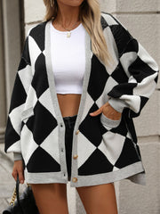 Argyle knit oversized cardigan in black and ivory with grey trim and pockets.