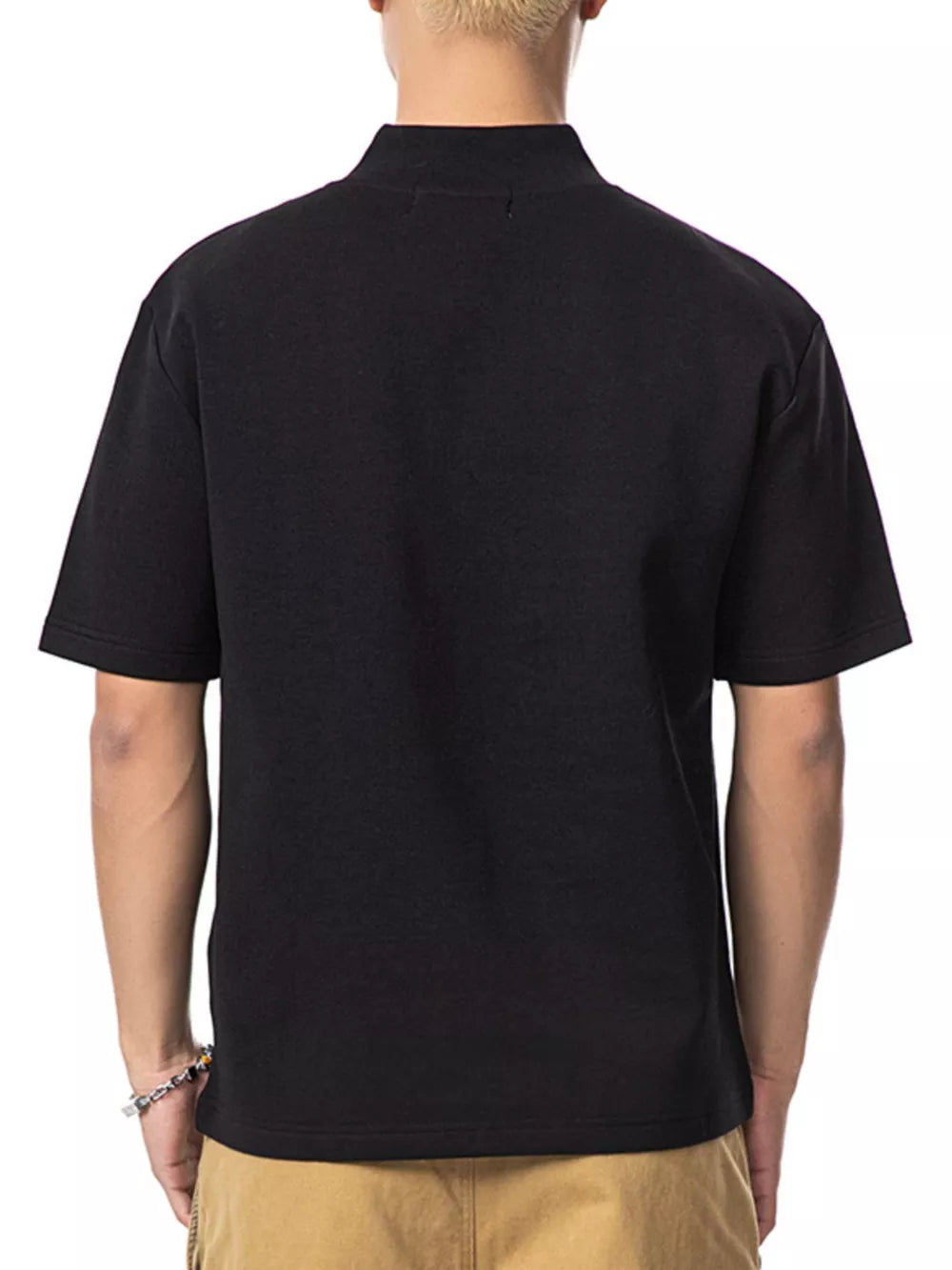 Black cotton mock neck t-shirt with short sleeves, shown from the back.
