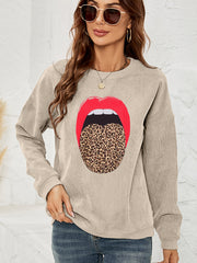 Corduroy crewneck sweatshirt in Tan with a bold red lip and leopard print tongue graphic.