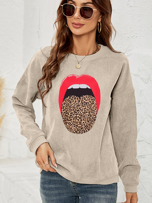 Corduroy crewneck sweatshirt in Tan with a bold red lip and leopard print tongue graphic.