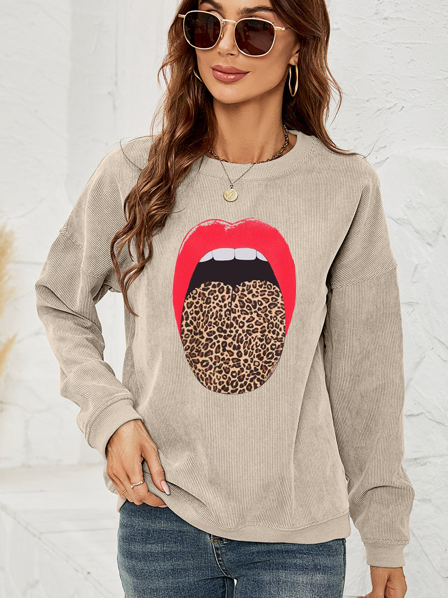 Corduroy crewneck sweatshirt in Tan with a bold red lip and leopard print tongue graphic.