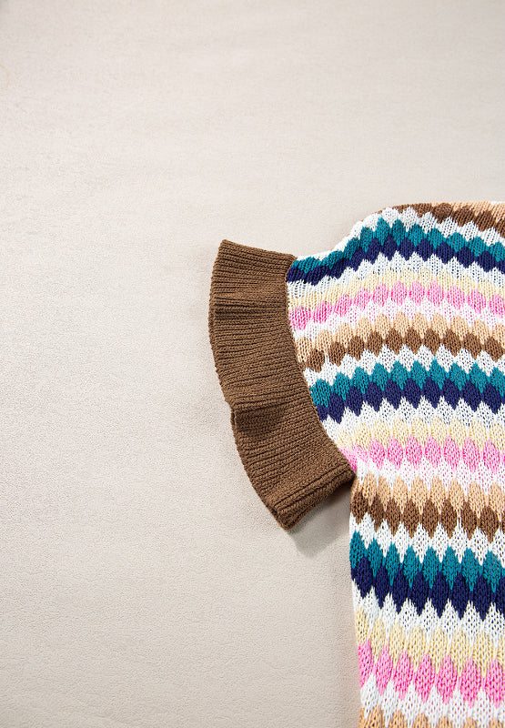 Textured knit sweater with multicolor diamond pattern and brown contrast trim sleeve detail.